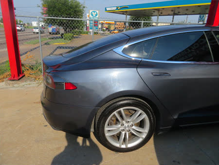 Tesla Model S after repair — straight rear quarter and bumper